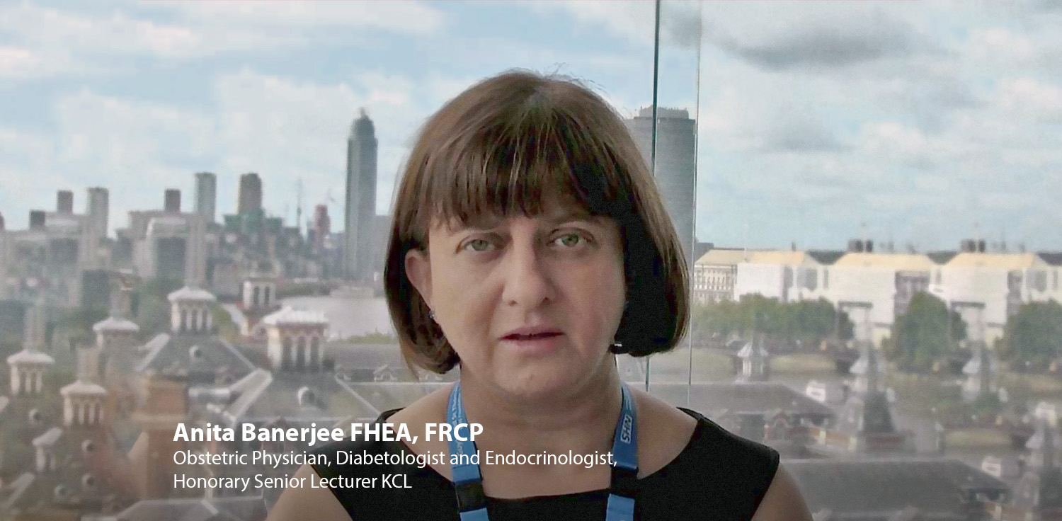 A picture of a woman wearing a NHS landlard looking directly into camera.